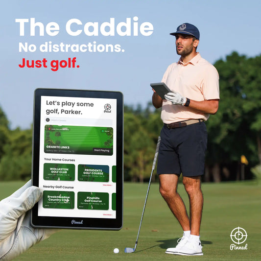Man holding a golf club with a tablet displaying a golf app on a golf course